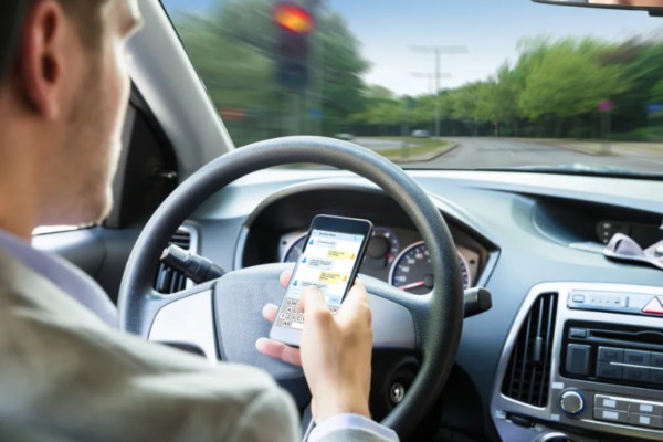 Top Driving Distractions That Contribute To Accidents, According To Experts