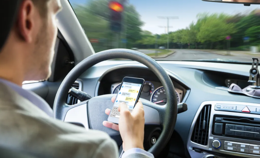 Top Driving Distractions That Contribute To Accidents, According To Experts